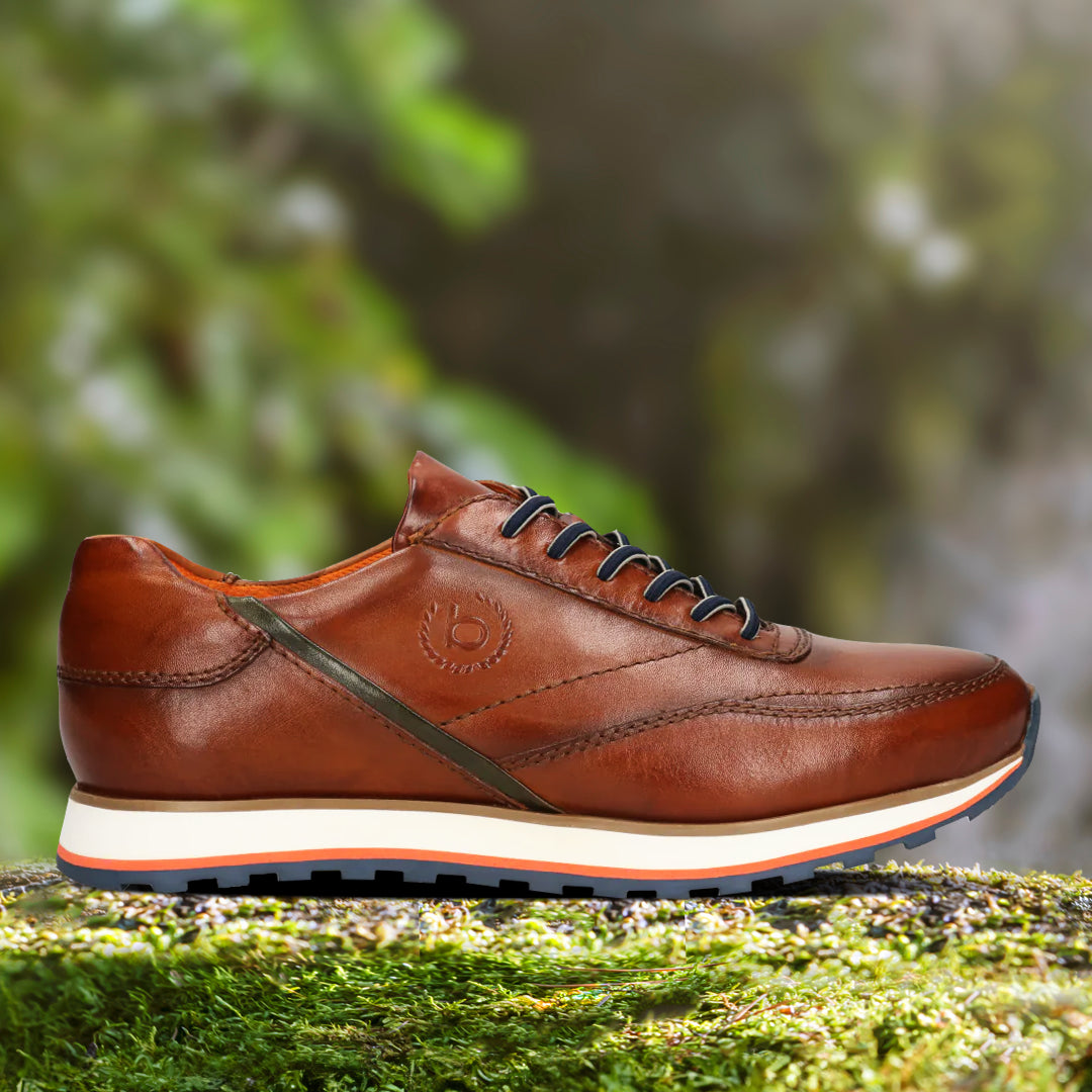 A cognac Men's bugatti Sneakers featuring a round toe plain toe, zero heels heel. Made from premium genuine leather with a durable eva outsole, this laces design offers both style and comfort.