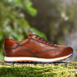 A cognac Men's bugatti Sneakers featuring a round toe plain toe, zero heels heel. Made from premium genuine leather with a durable eva outsole, this laces design offers both style and comfort.