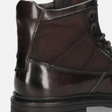 A brown Men's bugatti Ankle Boots featuring a round toe plain toe, moulded heel. Made from premium genuine leather with a durable tr outsole, this zipper design offers both style and comfort.