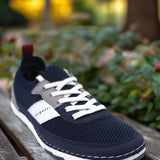 A blue Men's bugatti Sneakers featuring a round plain toe, zero heels heel. Made from textile with a durable tpr outsole, this laces design offers both style and comfort.