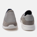 A grey Men's bugatti Slip-On Sneakers featuring a round plain toe, zero heels heel. Made from textile with a durable eva outsole, this slip-on design offers both style and comfort.