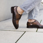 A brown Men's bugatti Brogue featuring a round wingcap, stacked heel. Made from premium genuine leather with a durable leather outsole, this laces design offers both style and comfort.