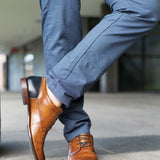 A cognac Men's bugatti Derby featuring a round plain toe, stacked heel. Made from premium genuine leather with a durable leather outsole, this laces design offers both style and comfort.