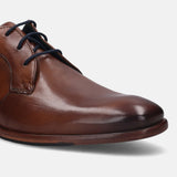 A cognac Men's bugatti Derby featuring a round plain toe, stacked heel. Made from premium genuine leather with a durable leather outsole, this laces design offers both style and comfort.