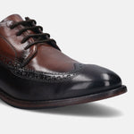 A brown Men's bugatti Brogue featuring a round wingcap, stacked heel. Made from premium genuine leather with a durable leather outsole, this laces design offers both style and comfort.