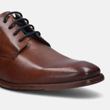 A cognac Men's bugatti Derby featuring a round plain toe, stacked heel. Made from premium genuine leather with a durable leather outsole, this laces design offers both style and comfort.