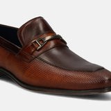 A cognac Men's bugatti Bit Loafer featuring a pointed toe apron toe, stacked heel. Made from premium genuine leather with a durable tpr outsole, this slip-on design offers both style and comfort.