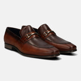 A cognac Men's bugatti Bit Loafer featuring a pointed toe apron toe, stacked heel. Made from premium genuine leather with a durable tpr outsole, this slip-on design offers both style and comfort.