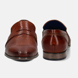 A cognac Men's bugatti Penny Loafer featuring a pointed toe plain toe, stacked heel. Made from premium genuine leather with a durable tpr outsole, this slip-on design offers both style and comfort.