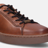 A cognac Men's bugatti Sneakers featuring a round toe plain toe, zero heels heel. Made from premium genuine leather with a durable tr outsole, this laces design offers both style and comfort.