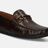 A brown Men's bugatti Casual Loafers featuring a square toe apron toe, zero heels heel. Made from patent leather with a durable tr outsole, this slip-on design offers both style and comfort.
