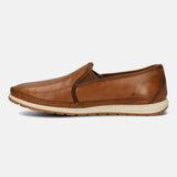 A brown Men's bugatti Slip-On Sneakers featuring a round toe plain toe, zero heels heel. Made from premium genuine leather with a durable tpr outsole, this slip-on design offers both style and comfort.