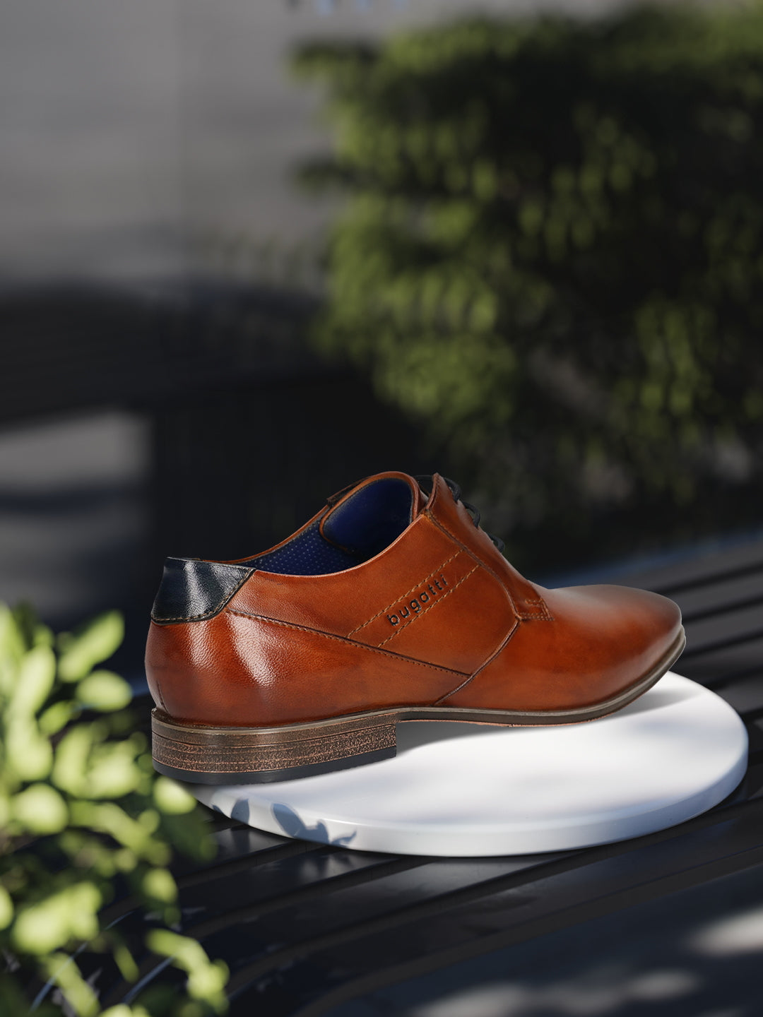 Men's Bugatti derby cognac leather shoes with a pointed toe and plain toe featuring a moulded heel , a pvc outsole , and laces fastening.