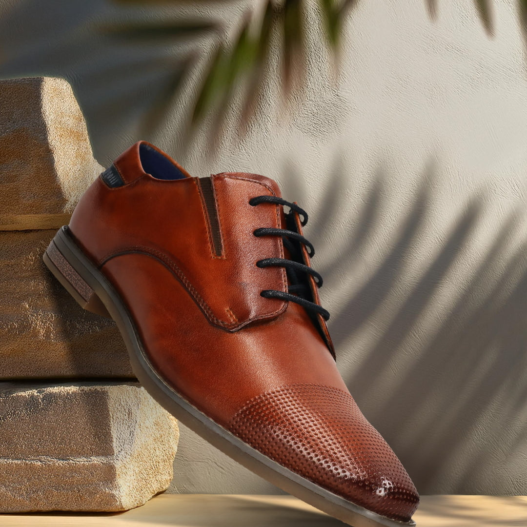 Men's Bugatti derby cognac leather shoes with a pointed toe and plain toe featuring a moulded heel , a tpr outsole , and laces fastening.