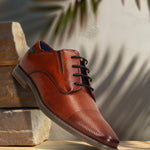 Men's Bugatti derby cognac leather shoes with a pointed toe and plain toe featuring a moulded heel , a tpr outsole , and laces fastening.