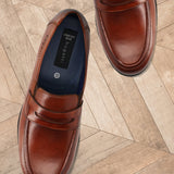 Men's Bugatti penny loafer cognac leather shoes with a pointed toe and apron toe featuring a moulded heel , a tpr outsole.