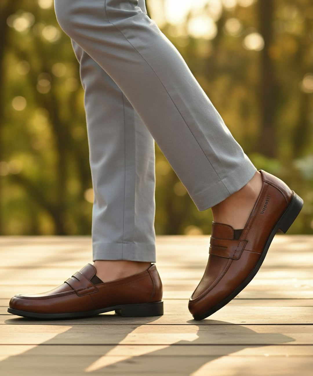 Men's Bugatti penny loafer cognac leather shoes with a pointed toe and apron toe featuring a moulded heel , a tpr outsole.