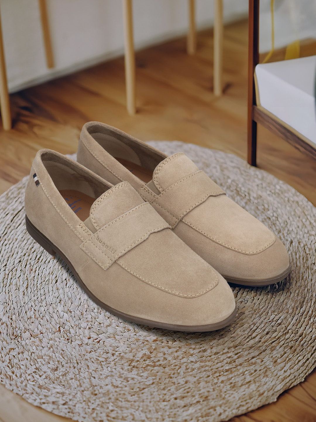 Men's Bugatti penny loafer beige leather shoes with a pointed toe and apron toe featuring a stacked heel , a tpr outsole.