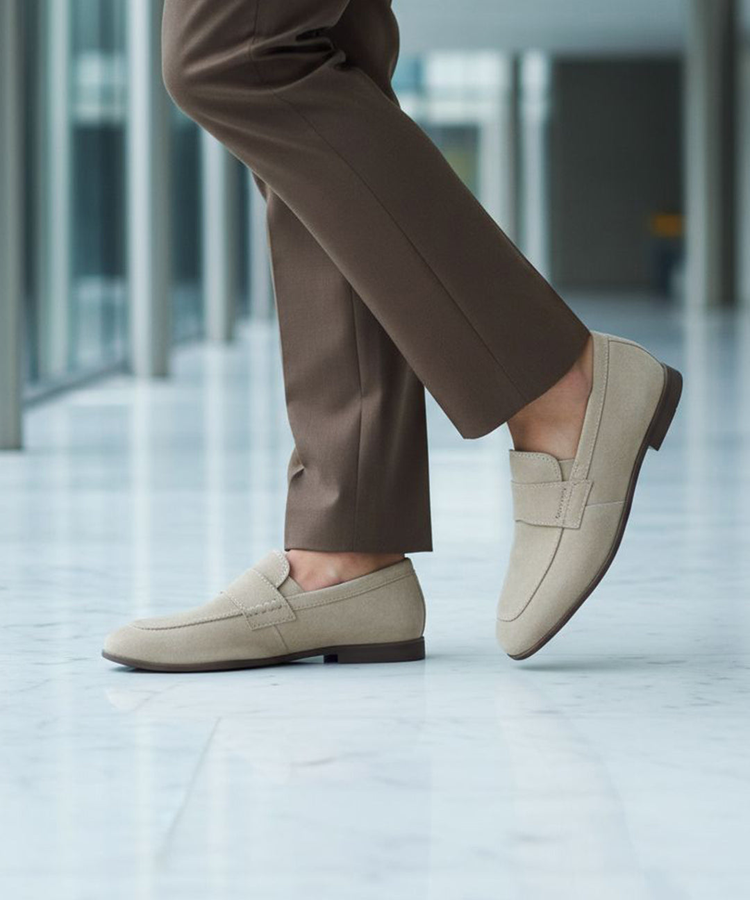 bugatti Tryst sand premium leather comfort penny loafers, beige suede with a dark sole, lifestyle close up.