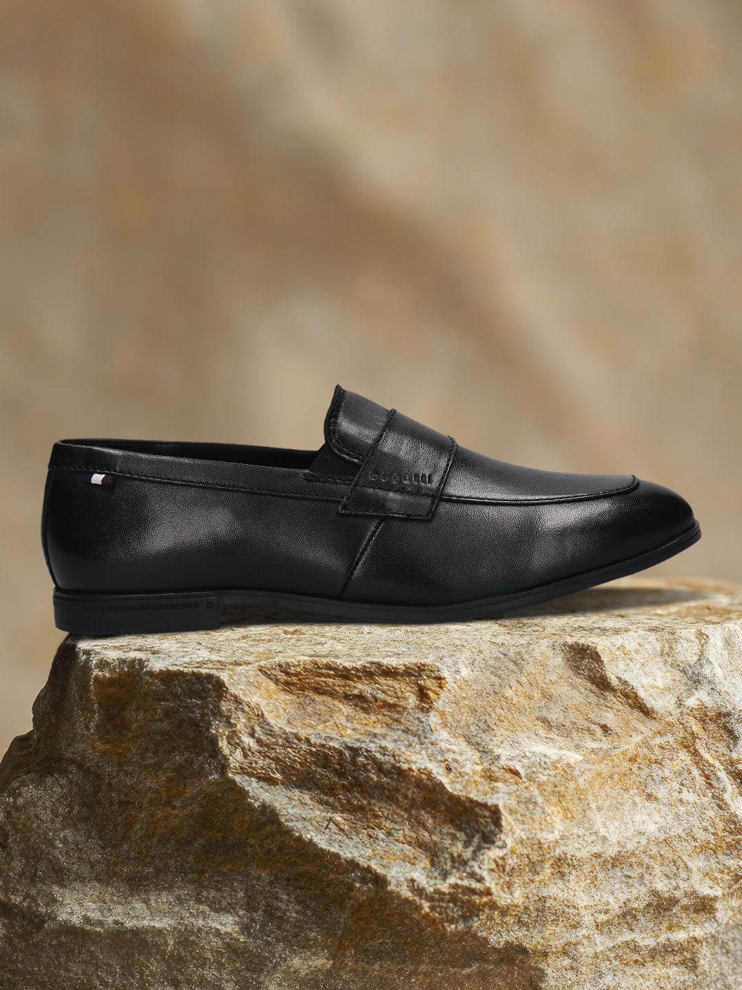 Men's Bugatti penny loafer black leather shoes with a pointed toe and apron toe featuring a stacked heel , a tpr outsole.