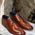 Men's Bugatti derby cognac leather shoes with a pointed toe and cap toe featuring a moulded heel , a tpr outsole , and laces fastening.
