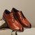 Men's Bugatti derby cognac leather shoes with a round toe and plain toe featuring a moulded heel , a tpr outsole , and laces fastening.