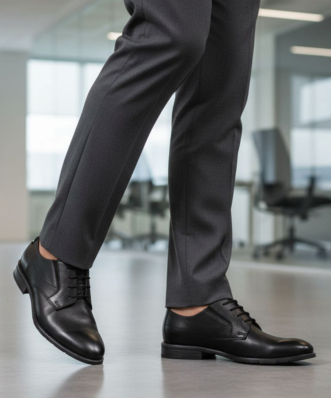 bugatti Lerio Comfort formal shoes in black premium leather, styled with dark grey dress pants.
