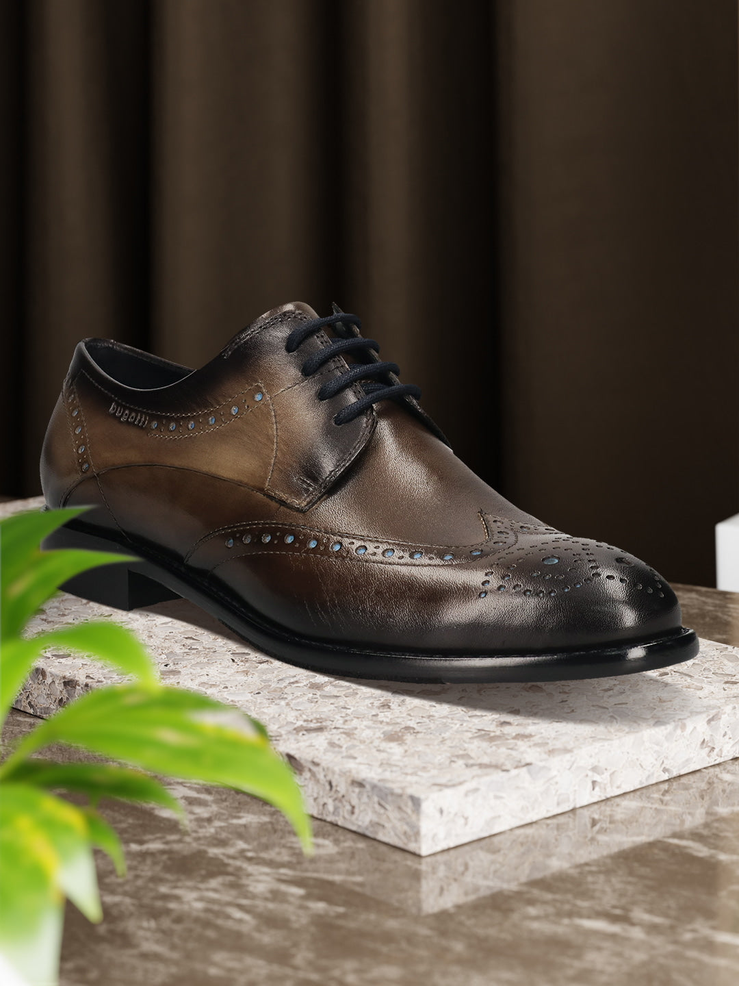 Men's Bugatti derby grey leather shoes with a round toe and wing tip featuring a stacked heel , a leather outsole , and laces fastening.
