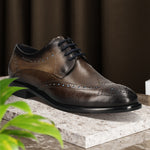 Men's Bugatti derby grey leather shoes with a round toe and wing tip featuring a stacked heel , a leather outsole , and laces fastening.