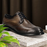 Men's Bugatti derby grey leather shoes with a round toe and wing tip featuring a stacked heel , a leather outsole , and laces fastening.