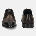 Men's Bugatti derby grey leather shoes with a round toe and wing tip featuring a stacked heel , a leather outsole , and laces fastening.