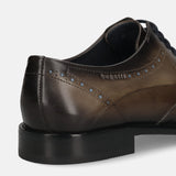 Men's Bugatti derby grey leather shoes with a round toe and wing tip featuring a stacked heel , a leather outsole , and laces fastening.