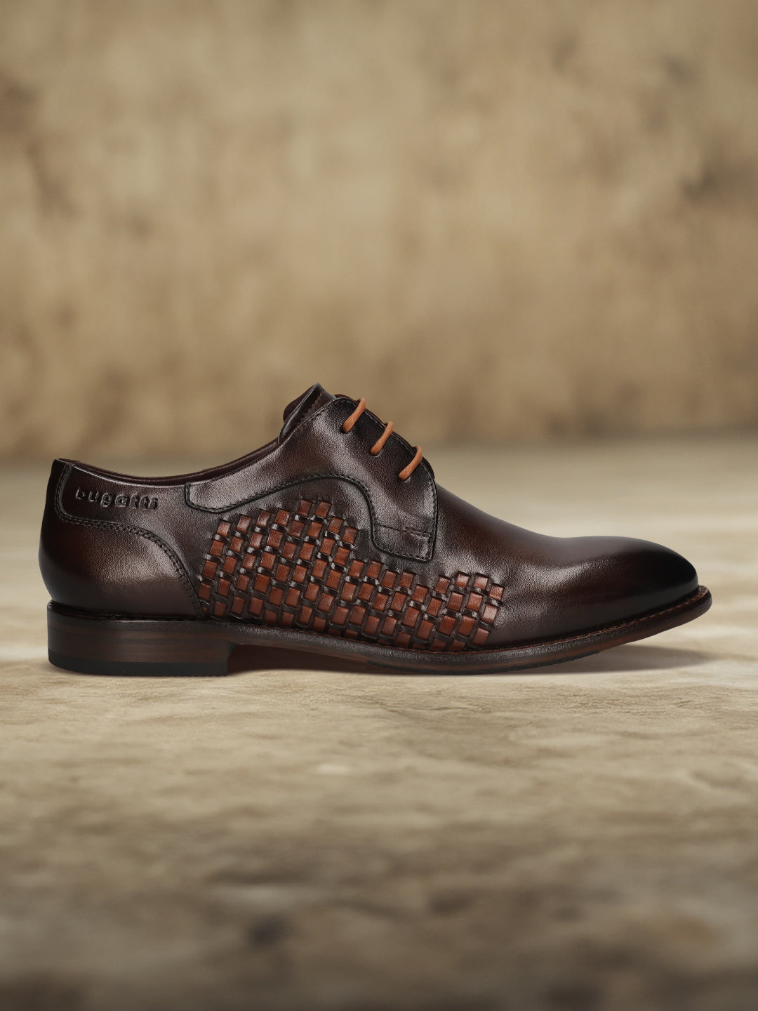 Men's Bugatti derby brown leather shoes with a round toe and plain toe featuring a stacked heel , a leather outsole , and laces fastening.