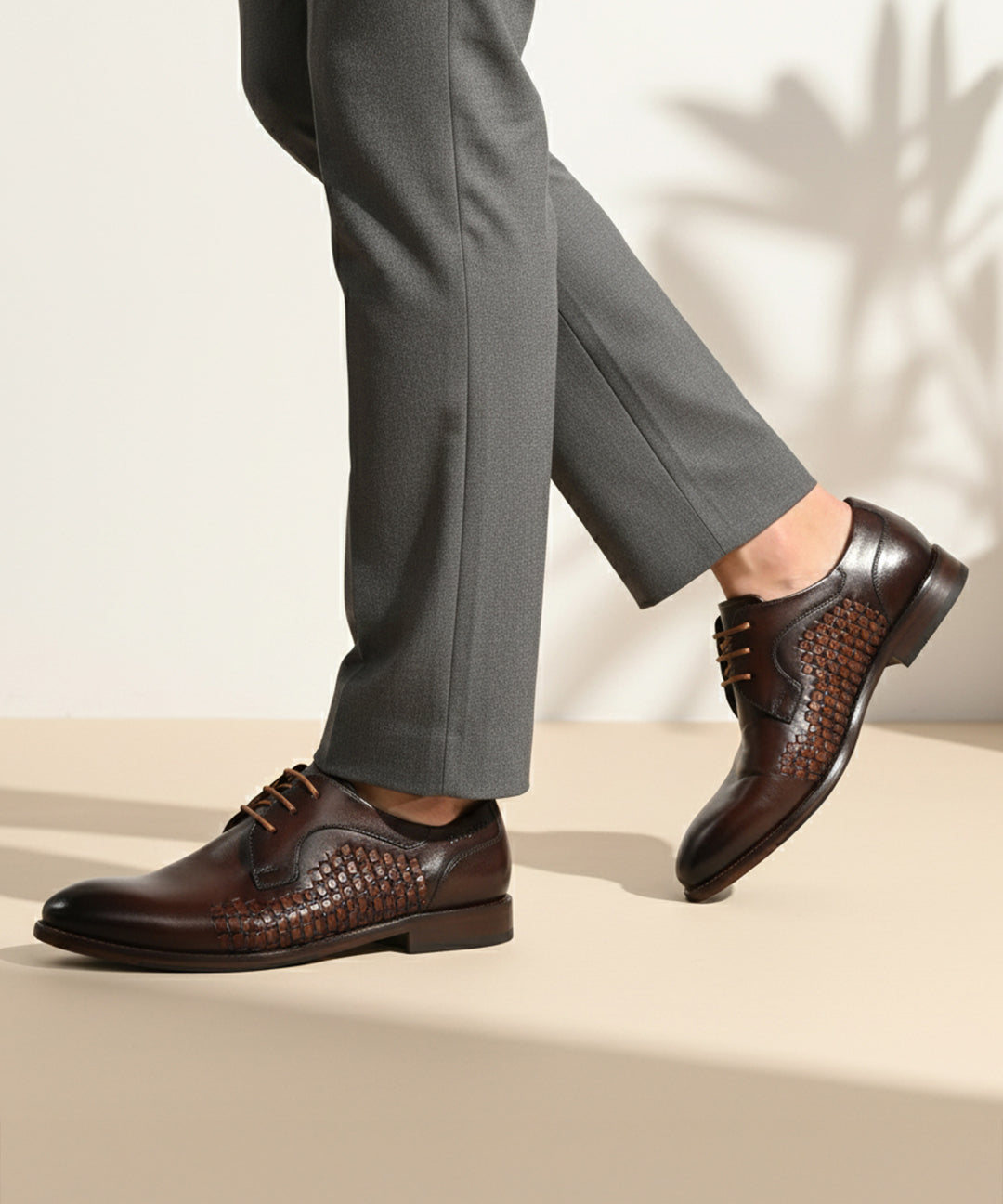 bugatti Livorno Flex Evo dark brown leather formal derby shoes with woven texture, paired with grey dress pants.