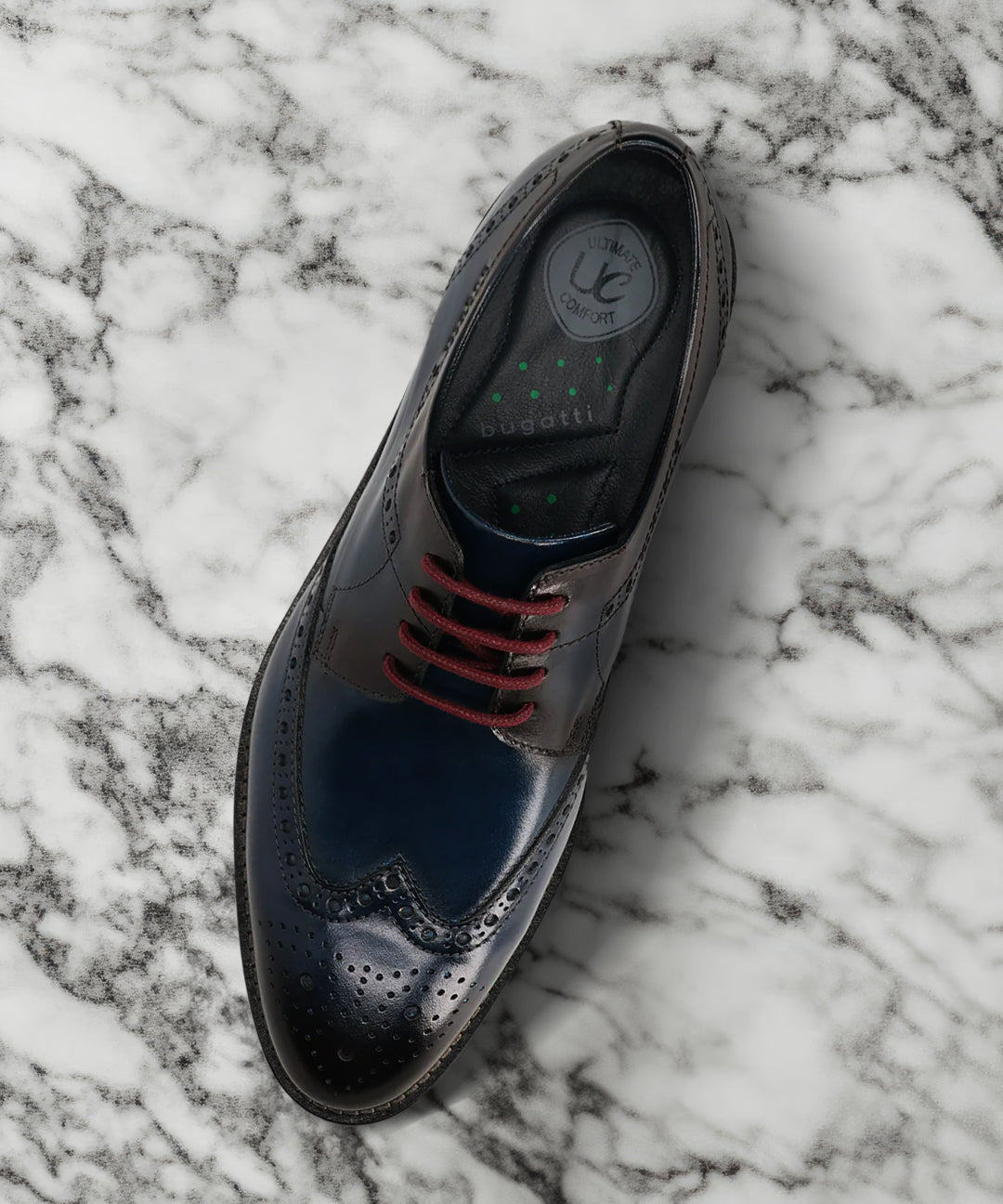 A blue Men's bugatti Derby featuring a round toe wing tip, stacked heel. Made from premium genuine leather with a durable leather outsole, this laces design offers both style and comfort.