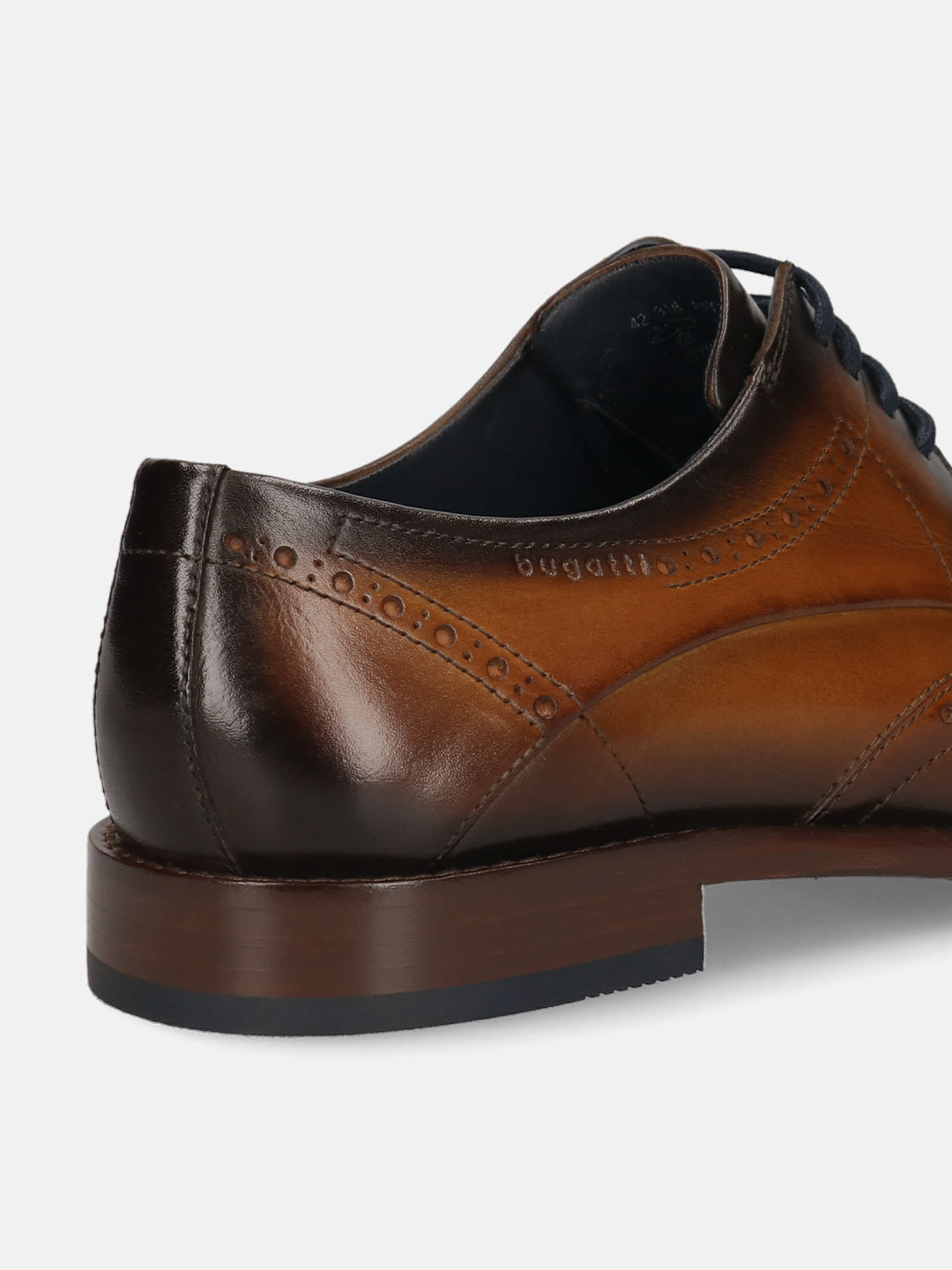 Men's Bugatti derby cognac leather shoes with a round toe and wing tip featuring a stacked heel , a leather outsole , and laces fastening.