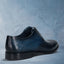 Men's Bugatti derby blue leather shoes with a round toe and wing tip featuring a stacked heel , a leather outsole , and laces fastening.