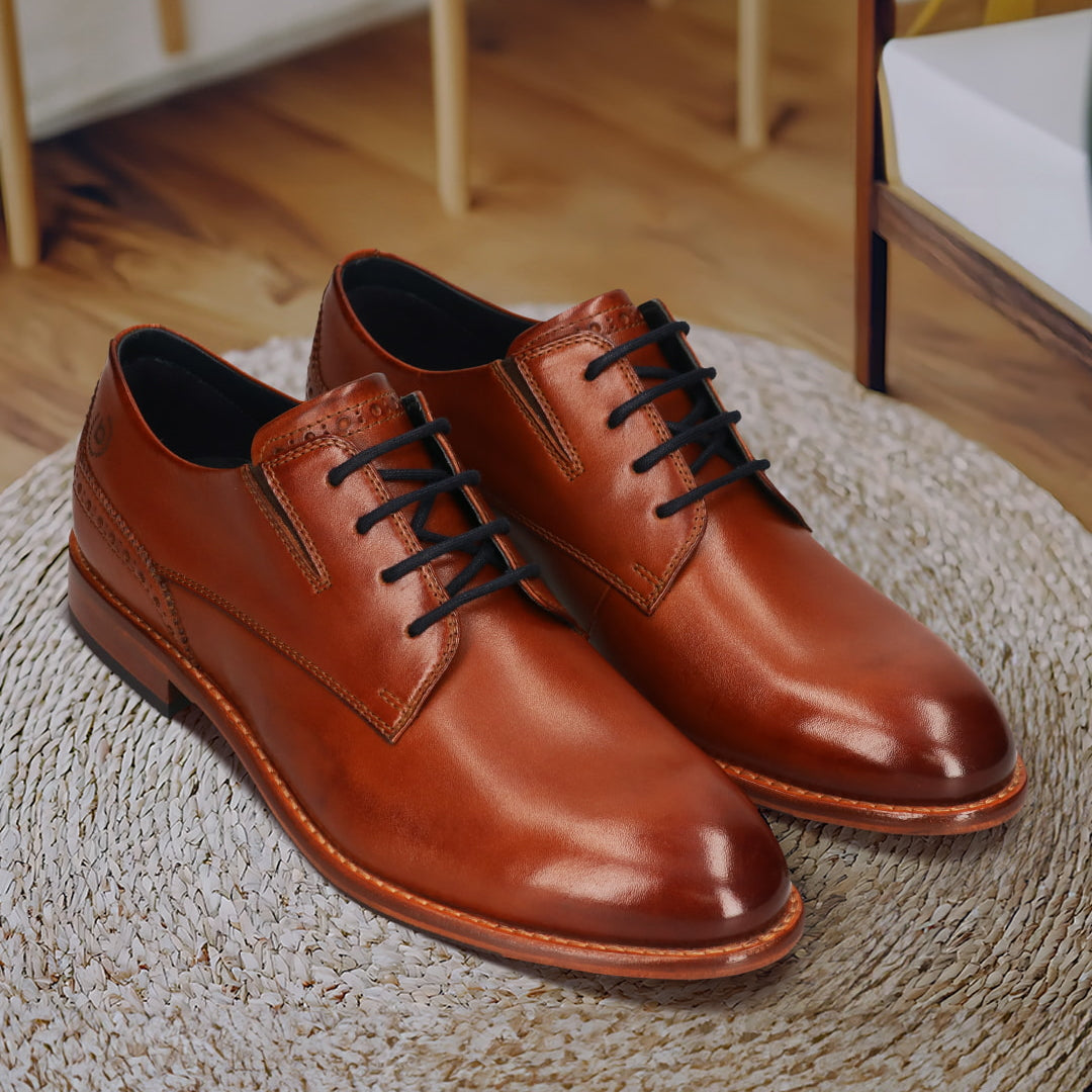 Men's Bugatti derby cognac leather shoes with a round toe and plain toe featuring a stacked heel , a leather outsole , and laces fastening.