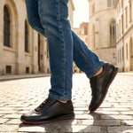 Person wearing black Men's bugatti Sneakers featuring a round plain toe, zero heels heel. Made from premium genuine leather with a durable tr outsole.