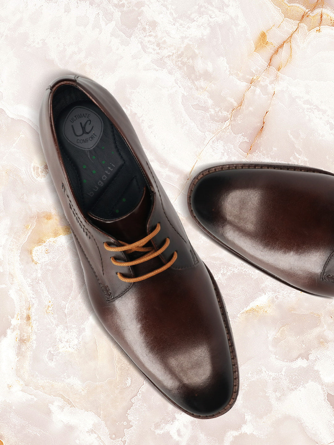 Men's Bugatti derby brown leather shoes with a pointed toe and plain toe featuring a stacked heel , a leather outsole , and laces fastening.