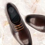 Men's Bugatti derby brown leather shoes with a pointed toe and plain toe featuring a stacked heel , a leather outsole , and laces fastening.