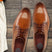 Men's Bugatti derby cognac leather shoes with a pointed toe and plain toe featuring a stacked heel , a leather outsole , and laces fastening.
