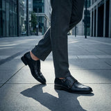 bugatti Zavinio black premium leather monk shoes with double buckle closure, gray pants, city background.