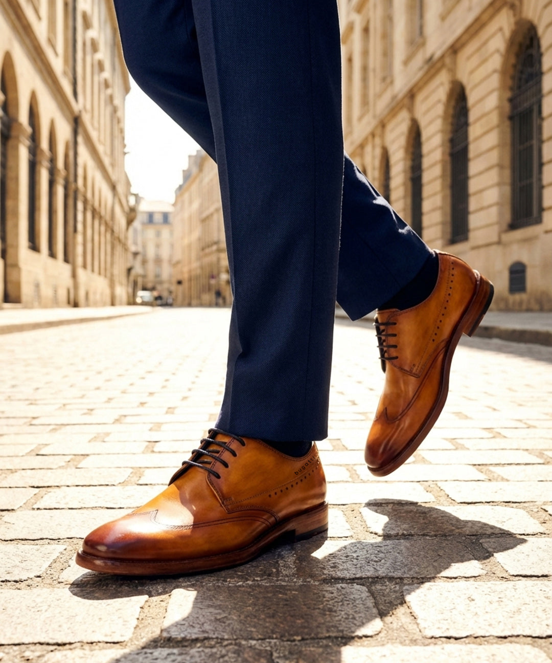 Lifestyle shot of the bugatti Mansaro Yellow Premium Leather Comfort Derby Formal shoes, styled with dark trousers.