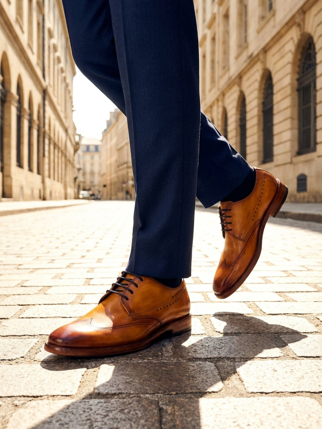 Lifestyle shot of the bugatti Mansaro Yellow Premium Leather Comfort Derby Formal shoes, styled with dark trousers.