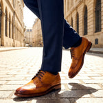 Lifestyle shot of the bugatti Mansaro Yellow Premium Leather Comfort Derby Formal shoes, styled with dark trousers.