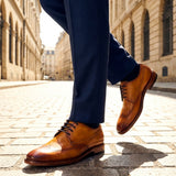 Lifestyle shot of the bugatti Mansaro Yellow Premium Leather Comfort Derby Formal shoes, styled with dark trousers.