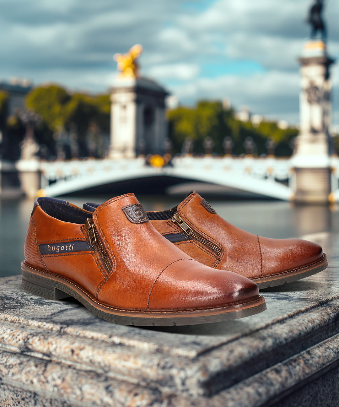 A cognac Men's bugatti Venetian Loafers featuring a round cap toe, moulded  heel, and a wide fit. Made from premium genuine leather with a durable tr outsole, this zipper design offers both style and comfort.