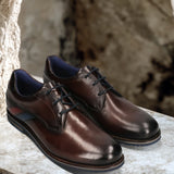 Men's Bugatti derby brown leather shoes with a round toe and plain toe featuring a stacked heel , a eva outsole , and laces fastening.
