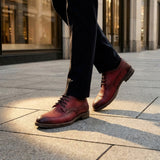 bugatti Ben Comfort Red Premium Leather Comfort Derby Formal shoes, with dark laces, paired with black dress pants.
